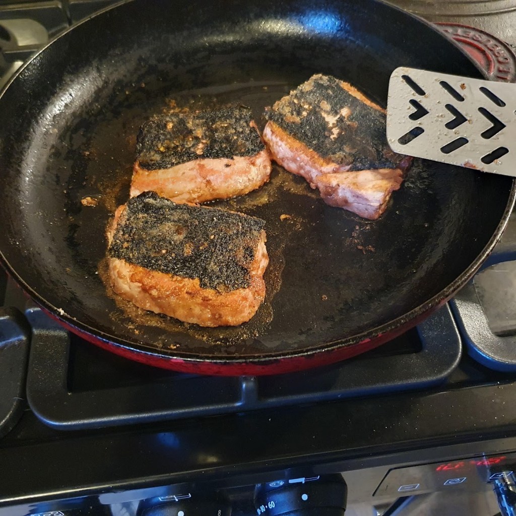 Salmon steaks frying