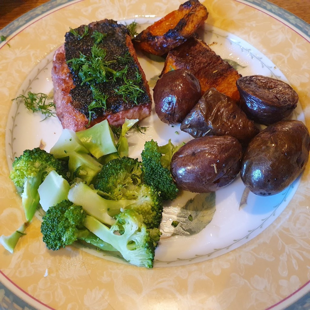 Salmon steak with purple potato and broccoli