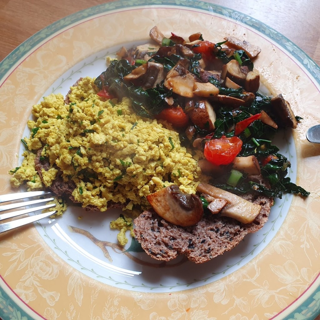 Scrambled tofu with vegetables on sourdough bread