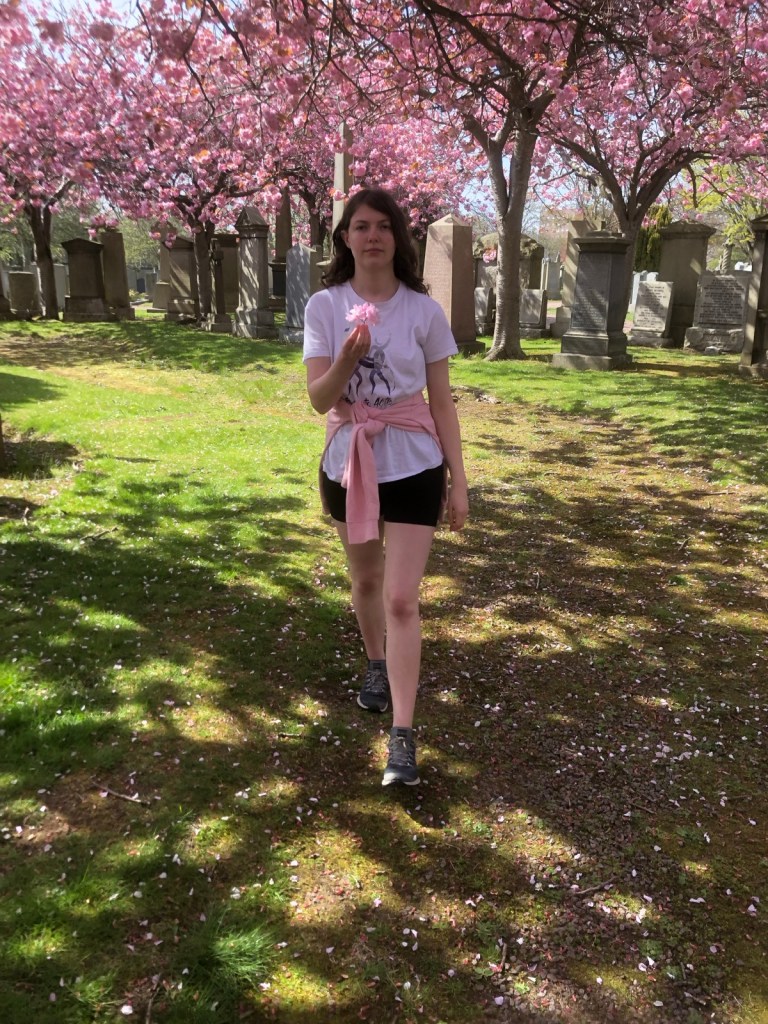 Elizabeth walking in the cemetery.