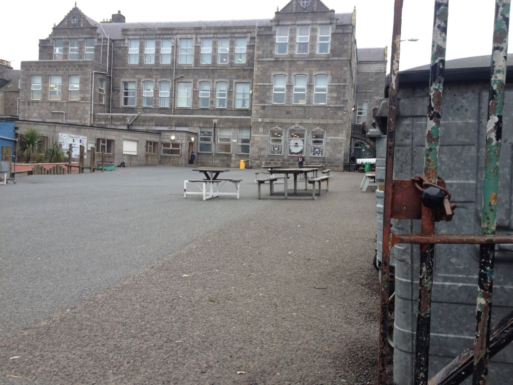 Ferryhill School playground in 2016 all tarmac with sad-looking tables