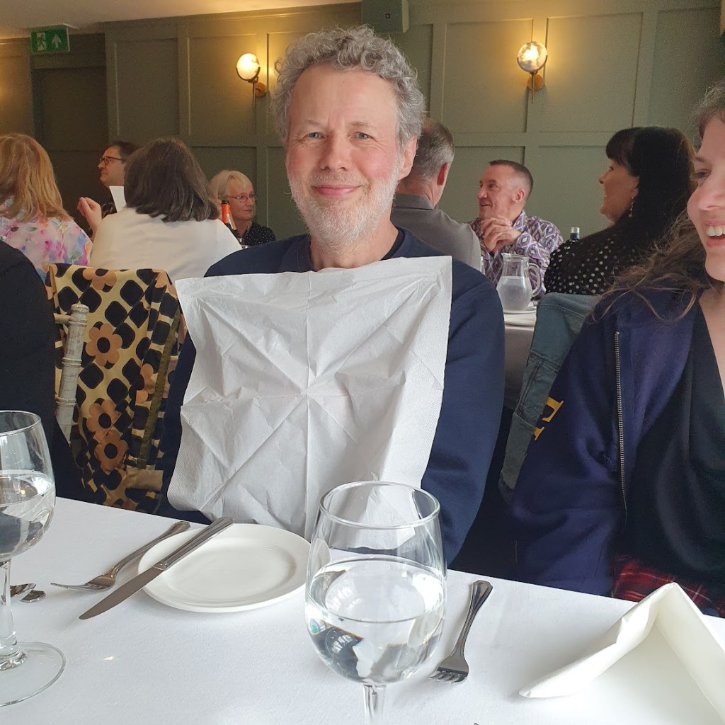 Ben with a napkin on his chest.