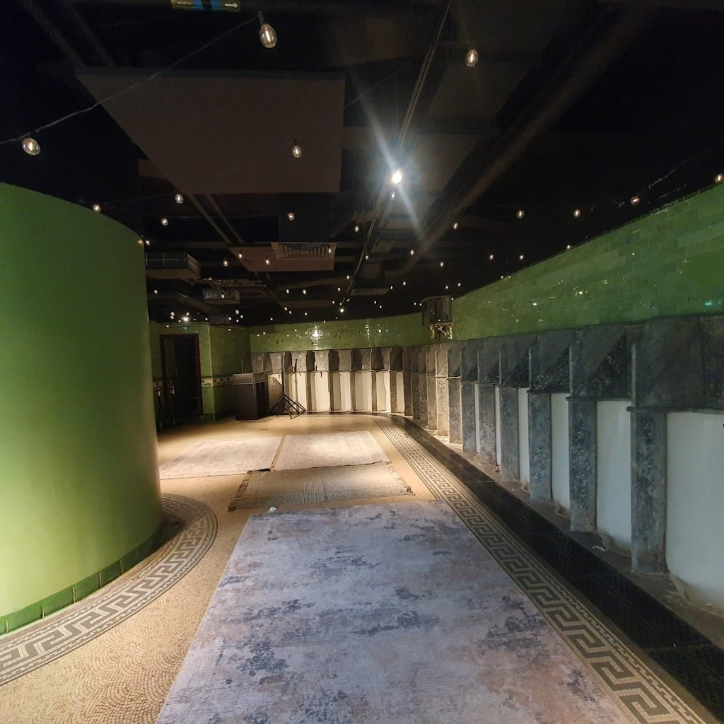 A wall of marble urinals in the Victorian toilets