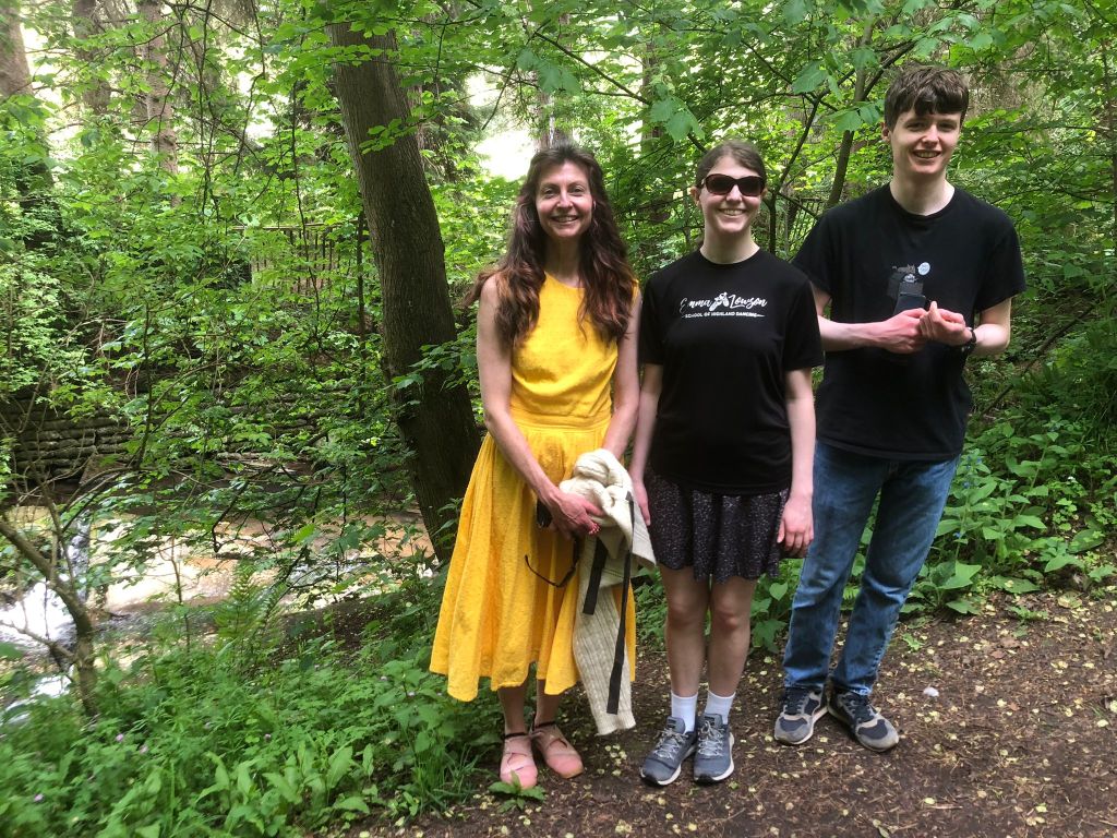 Me, Elizabeth and Daniel with the stream behind us and trees all around