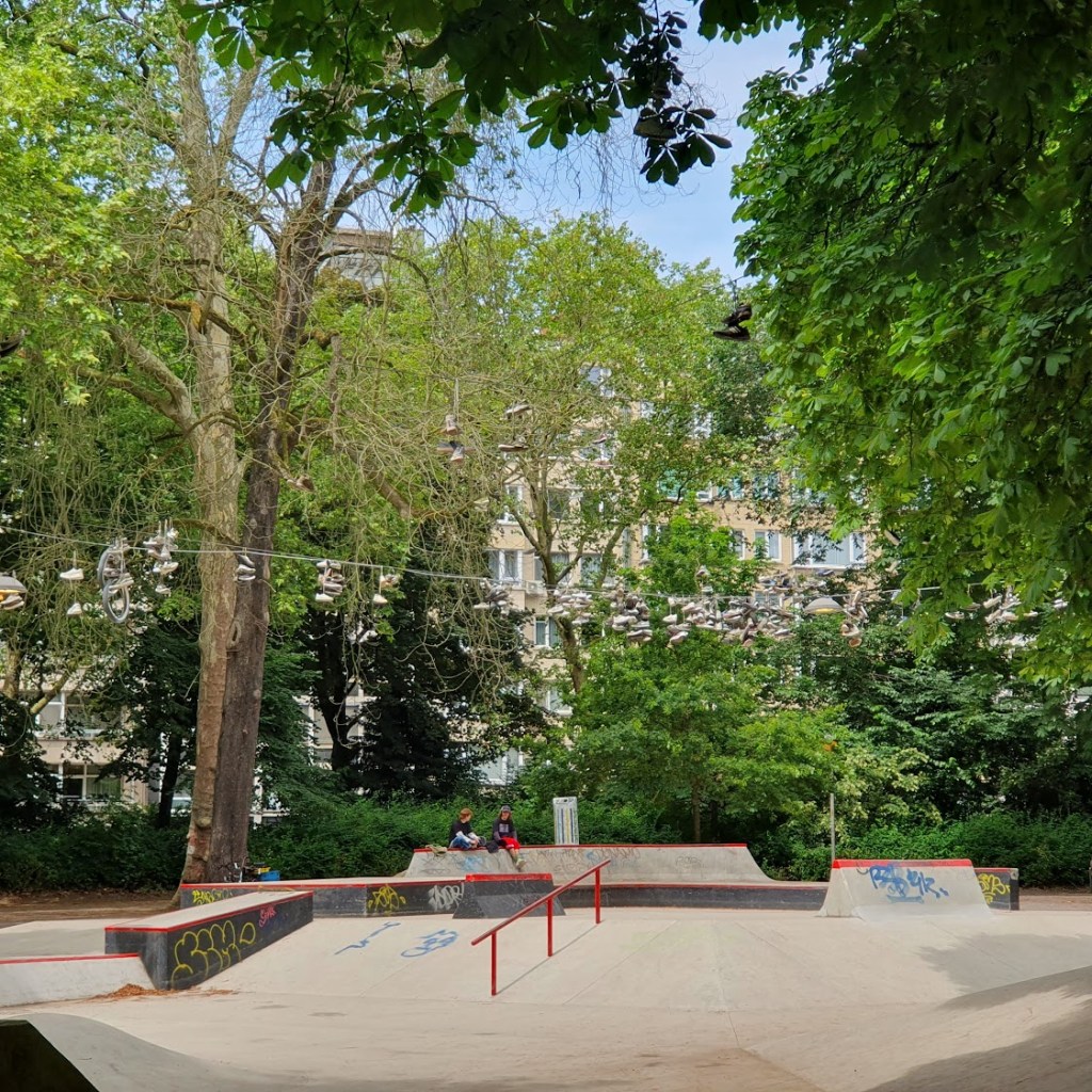 The skate park showing all the sneakers on the rope above.