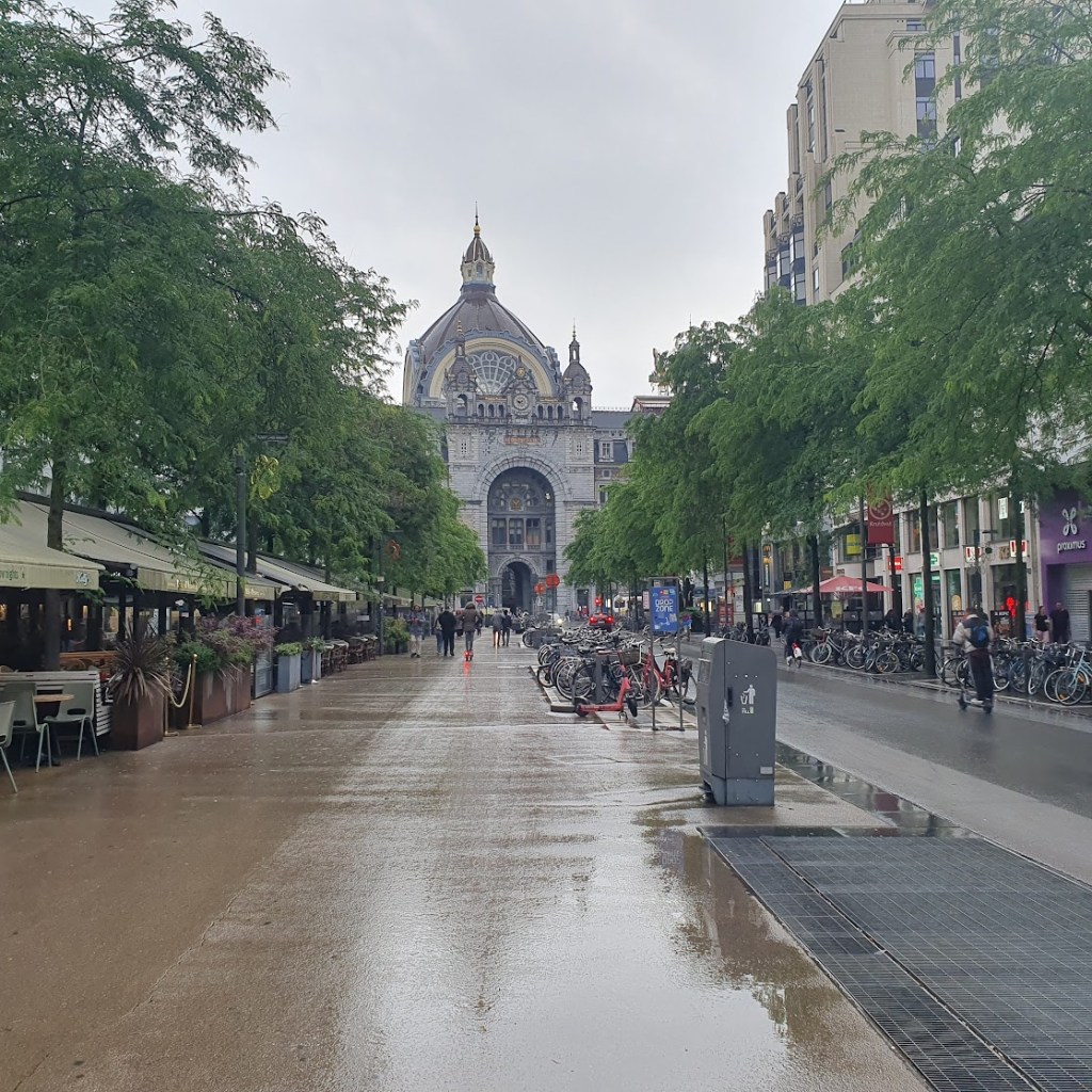 The train station from outside looking down a tree-lined street