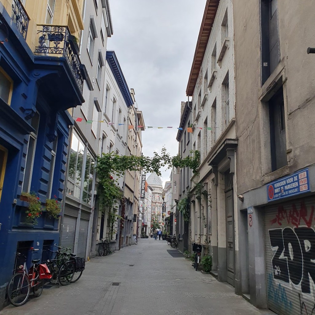 A narrow street view with bikes and no cars