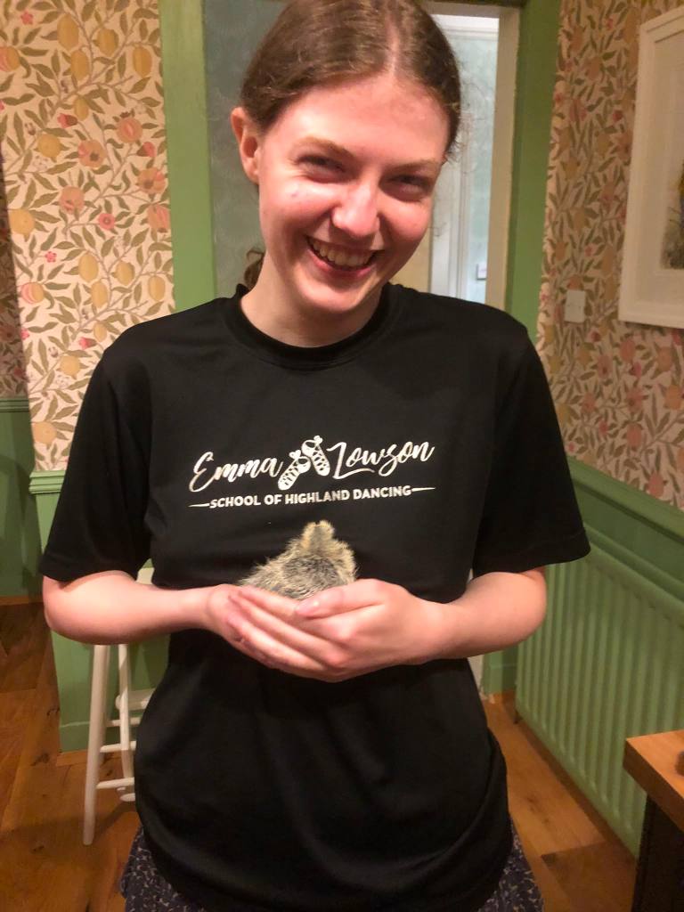 Elizabeth holding Mary and smiling.