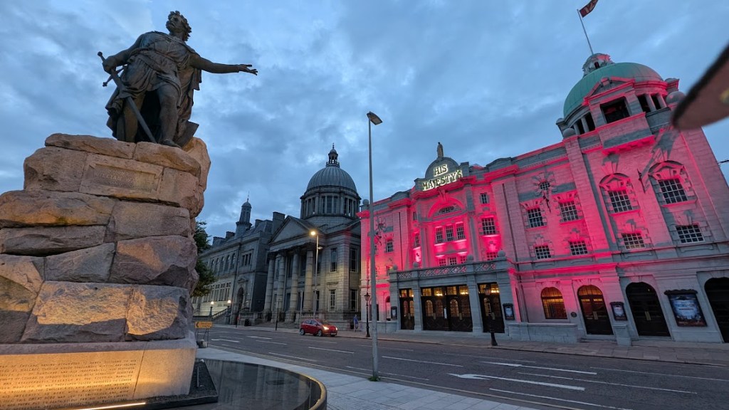 His Majesty's Theatre all lit up with the William Wallace statue pointing to it