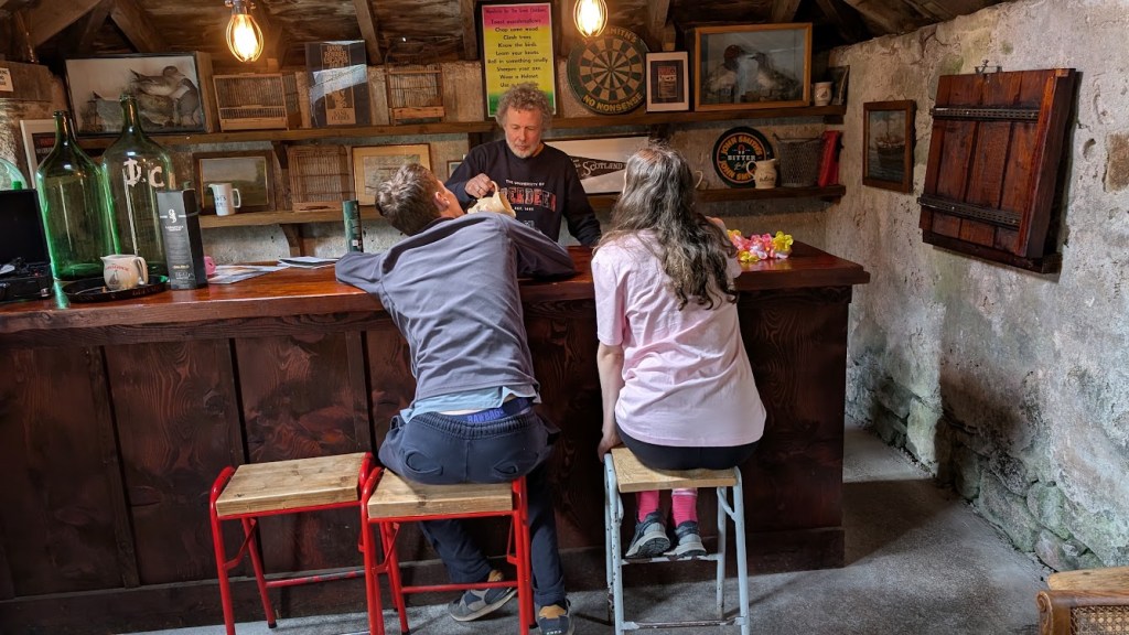 Ben in the Glen Dye Arms serving Daniel and Elizabeth