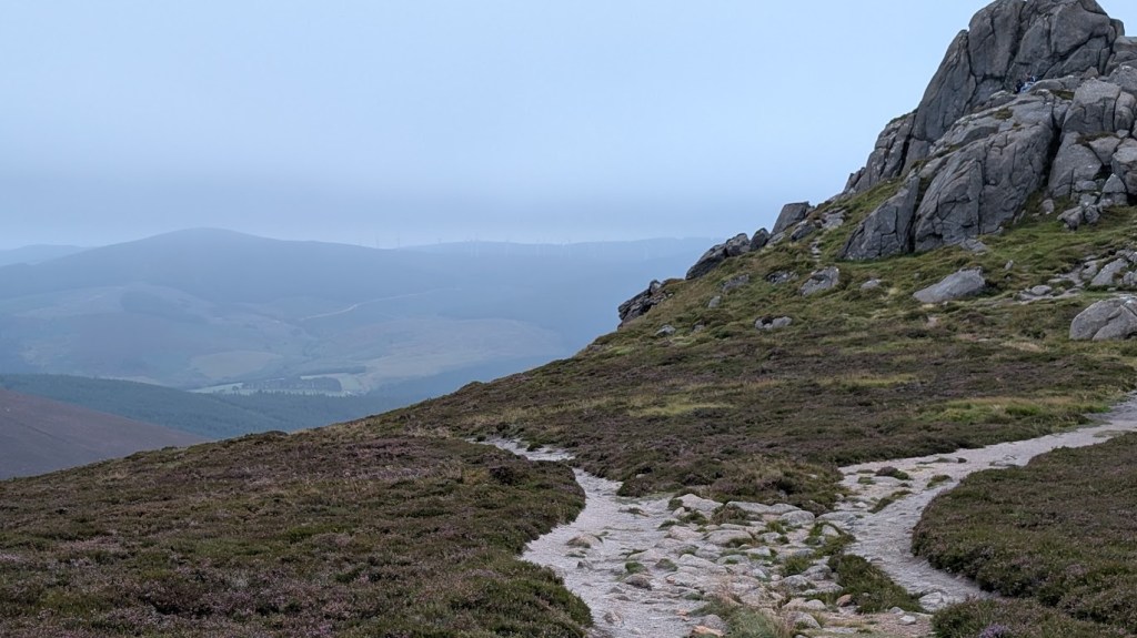 The rocky outcrop on the right with views on the left