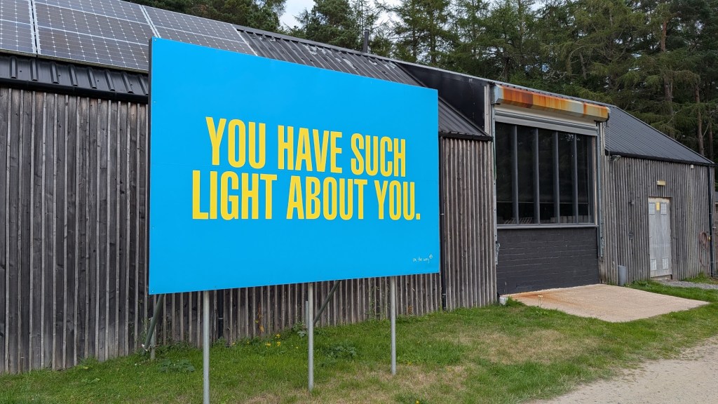 The clubhouse with a sign outside "You have such light about you."