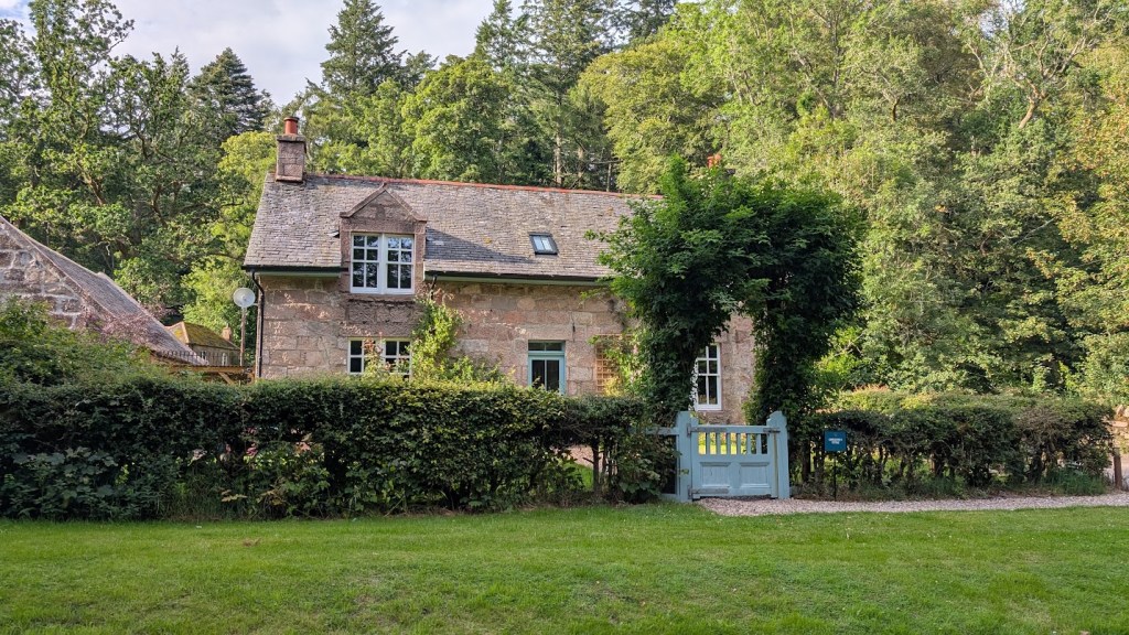 The stone cottage with a little blue gate