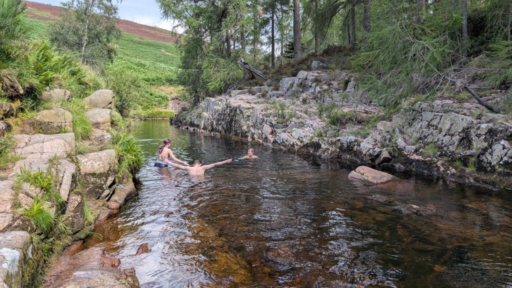 Elizabeth, Daniel and Ben in the water.