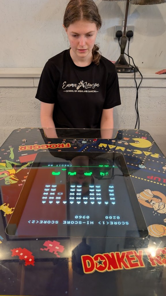 Elizabeth playing Space Invaders