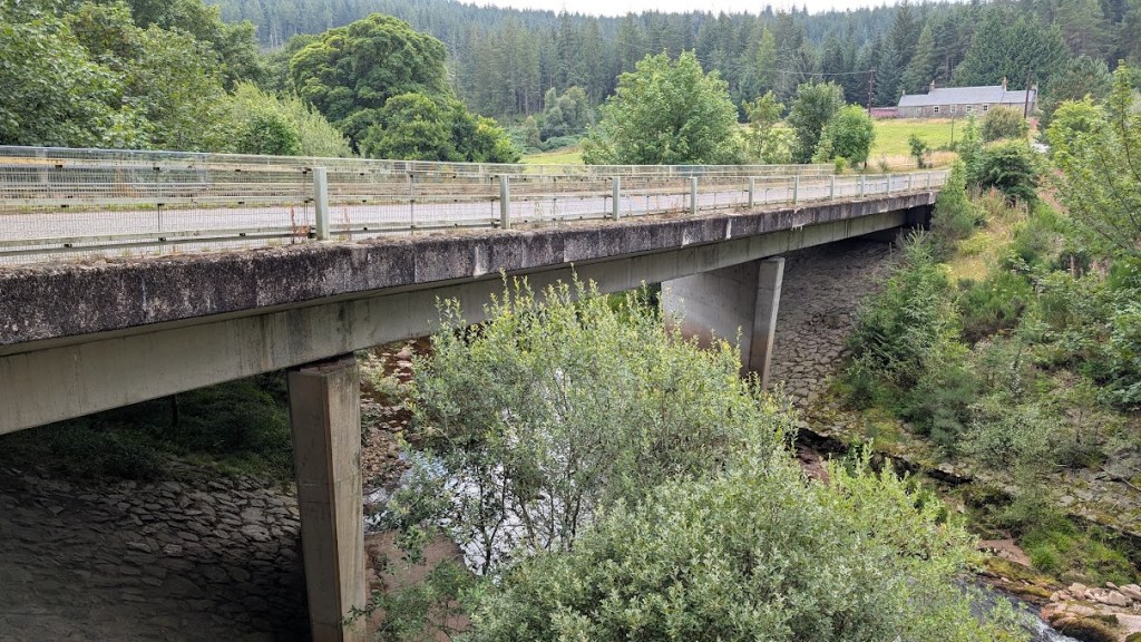 The modern ugly bridge crossing the Water of Dye.