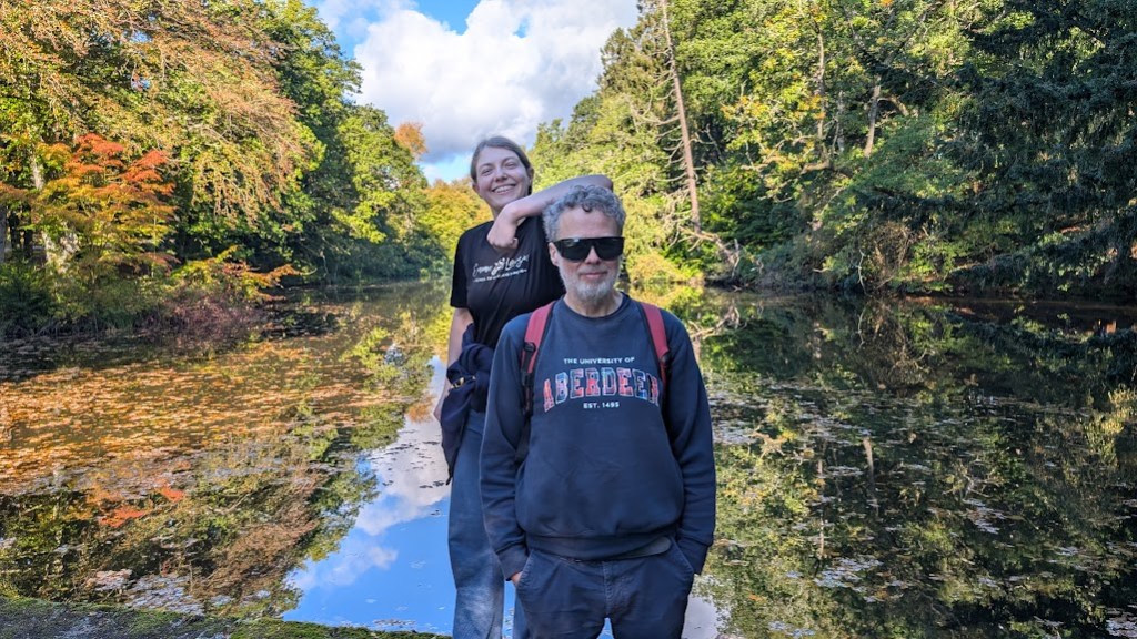 Elizabeth and Ben in front of the lake