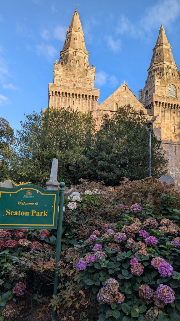 St Machars Cathedral with a sign saying Seaton Park in the foreground.
